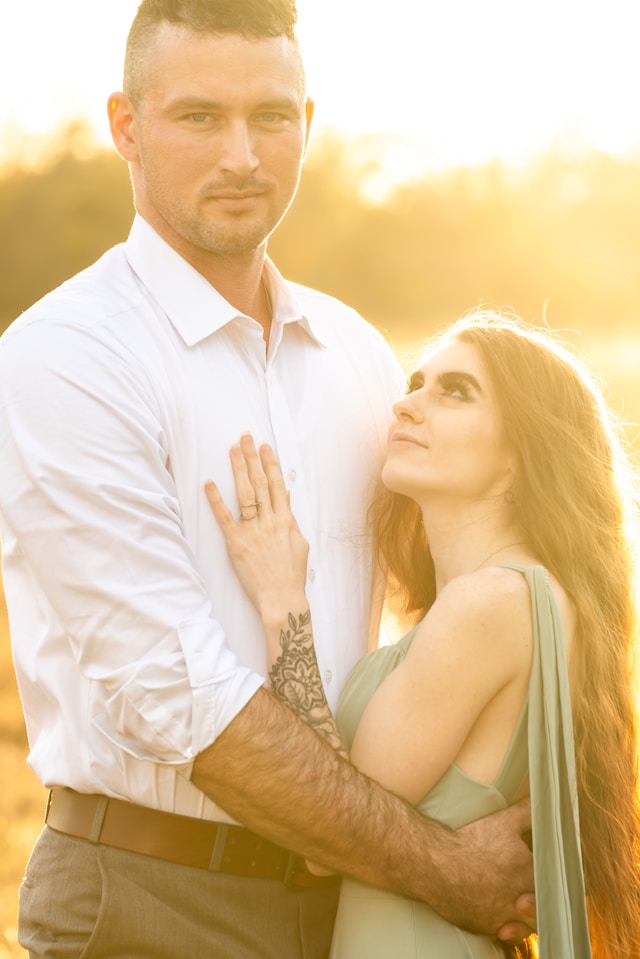 Female looking up at a strong man
